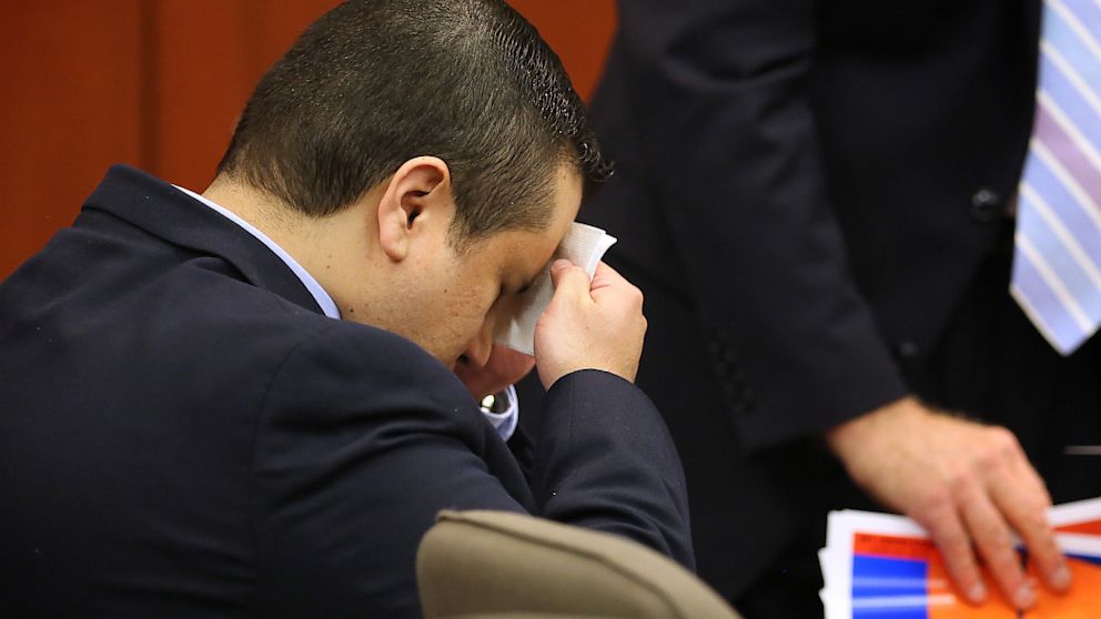 PHOTO: George Zimmerman wipes his face in the courtroom for  his trial at the Seminole County Criminal Justice Center, in Sanford, Fla., July 12, 2013.
