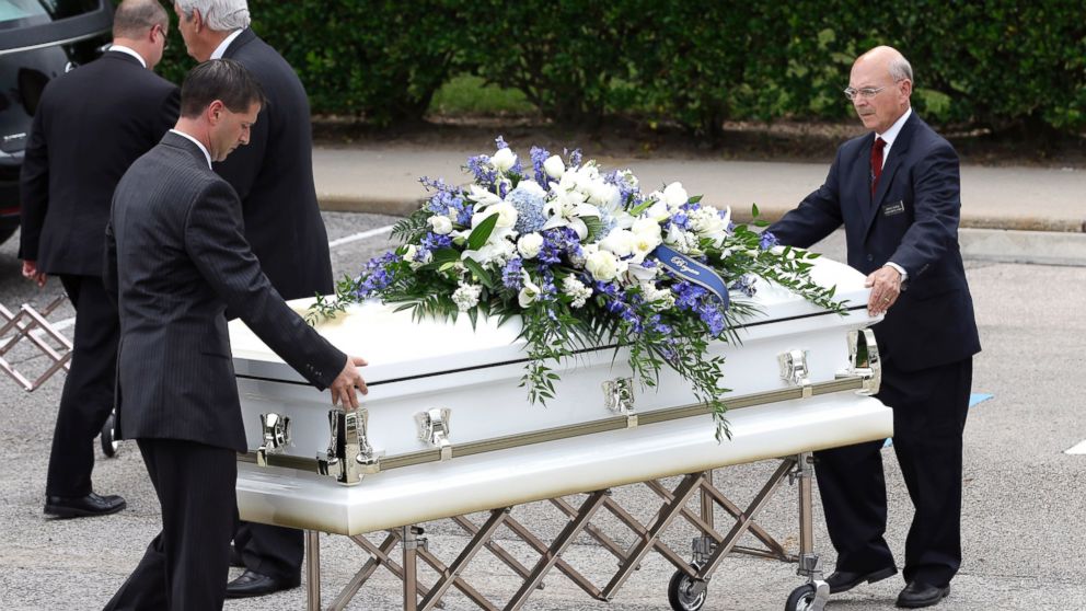 PHOTO: One of six caskets is moved into The Church of Jesus Christ of Latter-day Saints for a funeral service for members of the Stay family on July 16, 2014, in Houston.