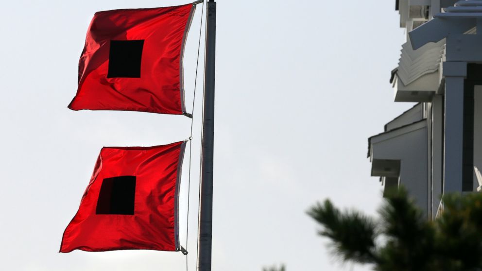 PHOTO: Hurricane warning flags fly in a Hatteras Village neighborhood, July 3, 2014, as residents prep for Hurricane Arthur in Outer Banks, N.C.