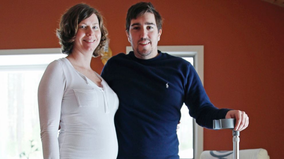 PHOTO: Jeff Bauman, who lost both legs in the Boston Marathon bombings, then helped authorities identify the suspects, poses with his expectant fiancé, Erin Hurley, their home in Carlisle, Mass., Friday, March 14, 2014.