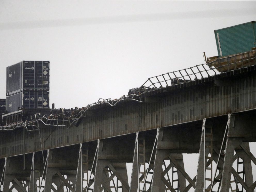PHOTO: Broken railing and train cars are seen on the Huey P. Long Bridge, which crosses over the Mississippi River, after several cars toppled from high winds in Jefferson Parish, La., just outside New Orleans, April 27, 2015.