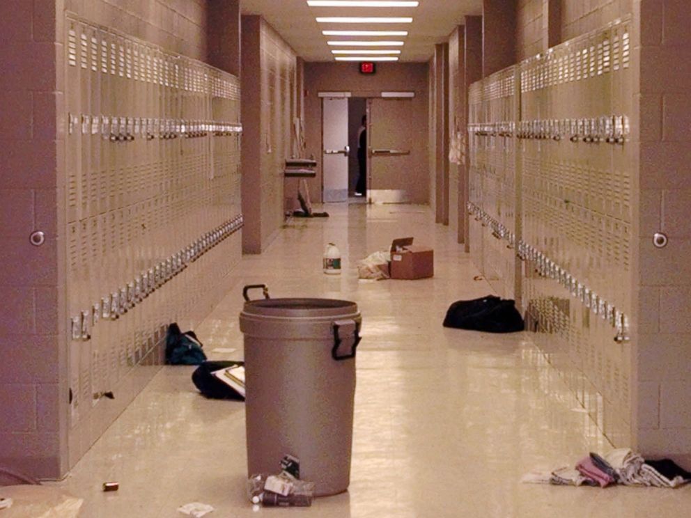 PHOTO: Backpacks and cleaning supplies lie in the hallway of Westside Middle School in Jonesboro, Ark., March 25, 1998. The view is from a door used by students to leave the building during a false fire alarm, followed by a shooting.
