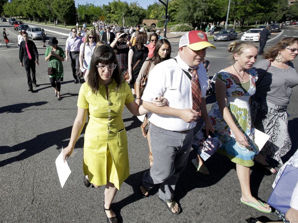 PHOTO: Kate Kelly, left, walks with supporters to the Church Office Building of the Church of Jesus Christ of Latter-day Saints, June 22, 2014, in Salt Lake City.