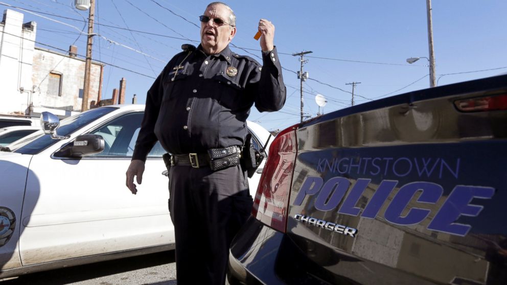 PHOTO: Knightstown Police Chief Danny Baker talks about the condition of the departments patrol cars outside the station in Knightstown, Ind. Baker is trying to raise money to lease a new car for the department by agreeing to be shot with his Taser.