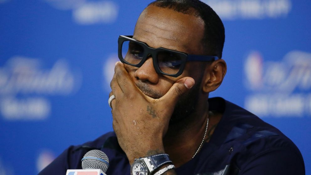 PHOTO: Miami Heat forward LeBron James listens to a question during a news conference after Game 5 of the NBA basketball finals against the San Antonio Spurs, June 15, 2014, in San Antonio.