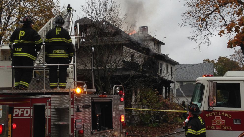 PHOTO: Firefighters work to douse a fire that killed three, injured one and left several people unaccounted for, Nov. 1, 2014 in Portland, Maine.