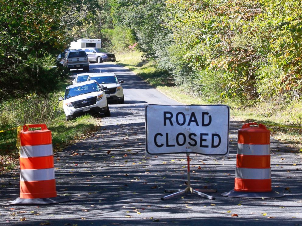 PHOTO: A road closed sign blocks traffic as authorities search a rural area where human remains were discovered in Albermarle County, Va., Oct. 19, 2014. 