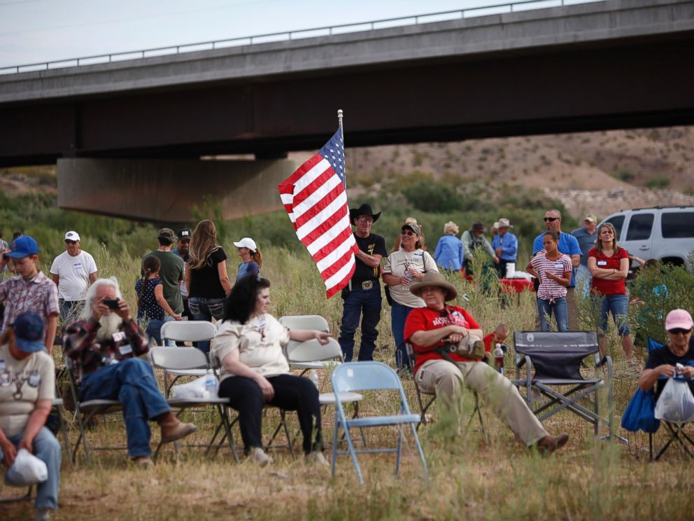 PHOTO: People gather along the Virgin River during a rally in support of Cliven Bundy near Bunkerville, Nev. Friday, April 18, 2014. 