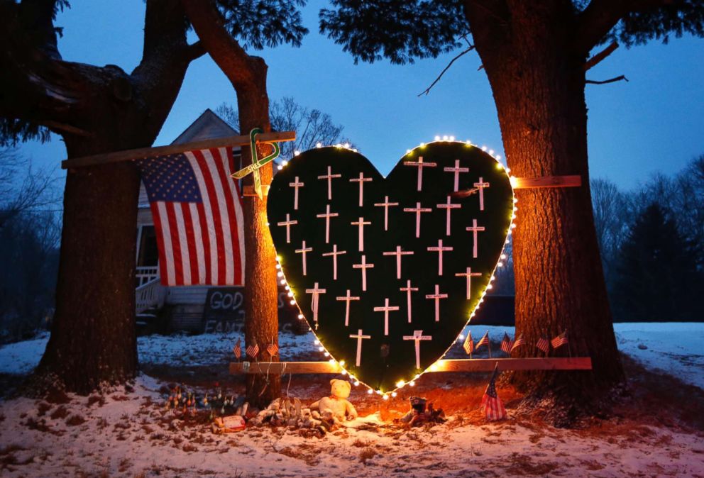 PHOTO: A memorial with crosses for the victims of the Sandy Hook Elementary School shooting massacre stands outside a home in Newtown, Conn., on the one-year anniversary of the shootings, Dec. 14, 2013.