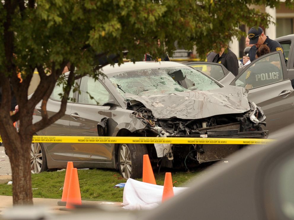 PHOTO:Police investigate a damaged car after the vehicle crashed into a crowd of spectators during the Oklahoma State University homecoming parade, causing multiple injuries, Oct. 24, 2015, in Stillwater, Oka.