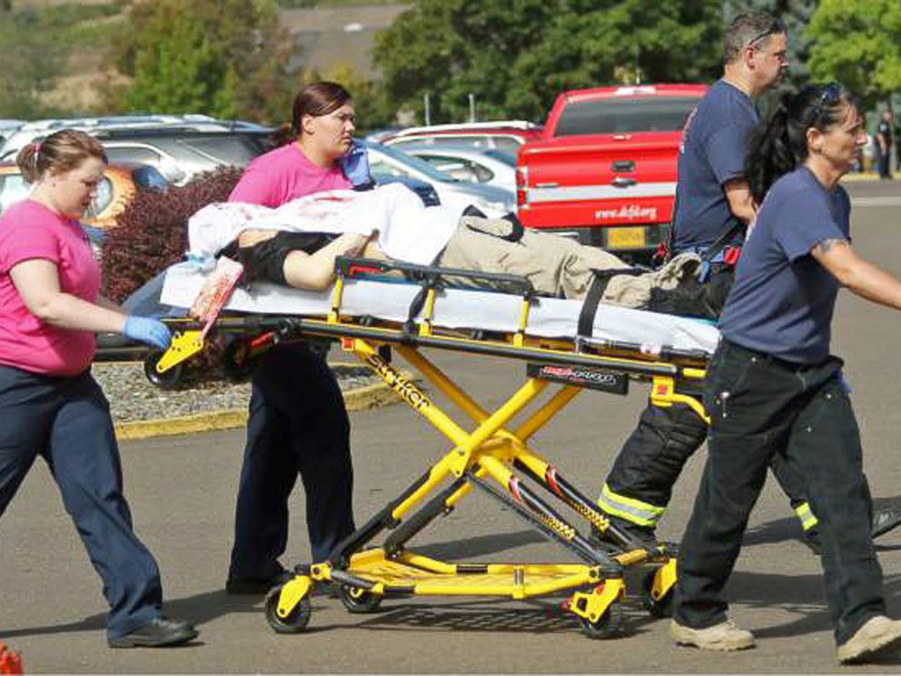 PHOTO: Authorities carry a shooting victim away from the scene after a gunman opened fire at Umpqua Community College in Roseburg, Ore., Oct. 1, 2015.