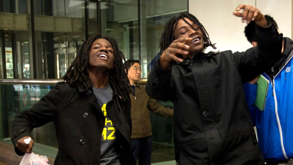 PHOTO: U.S. rappers Pacman, left, and Peso perform a dance at the Beijing Capital Airport in Beijing, after returning from Pyongyang, North Korea Saturday, Nov. 30, 2013.