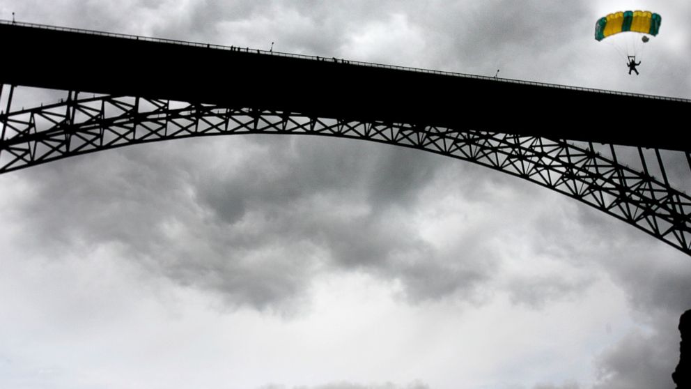 PHOTO: In this file photo, a BASE jumper guides his chute to the riverbank after leaping from the Perrine Bridge in Twin Falls, Idaho on May 28, 2006.