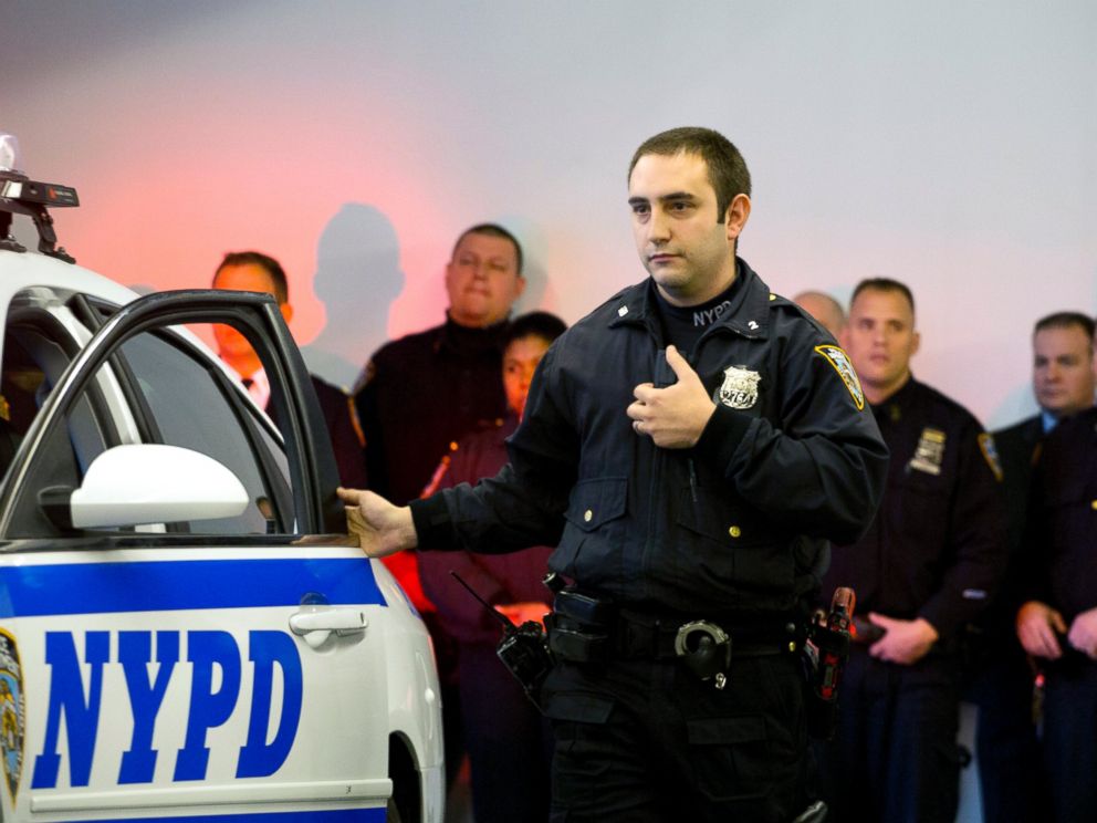 PHOTO: New York Police Department officer Joshua Jones turns on a body camera attached to his chest during a traffic stop training demonstration for the media, Dec. 3, 2014 in New York.