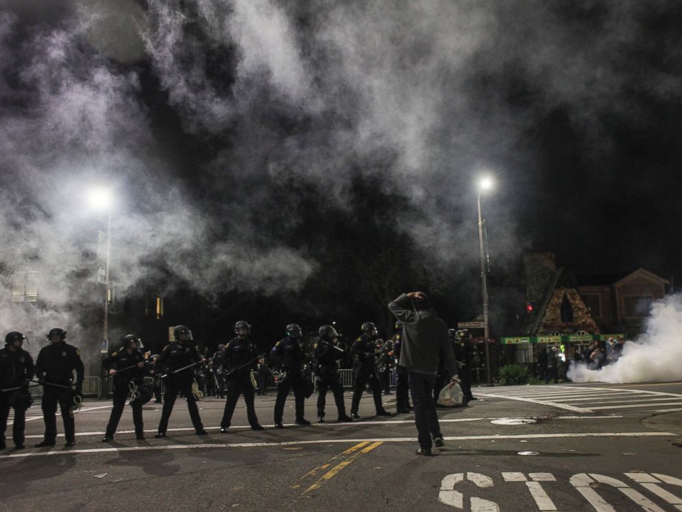 PHOTO: Demonstrators toss out smoke bombs during a march in Berkeley, Calif., Dec. 6, 2014.