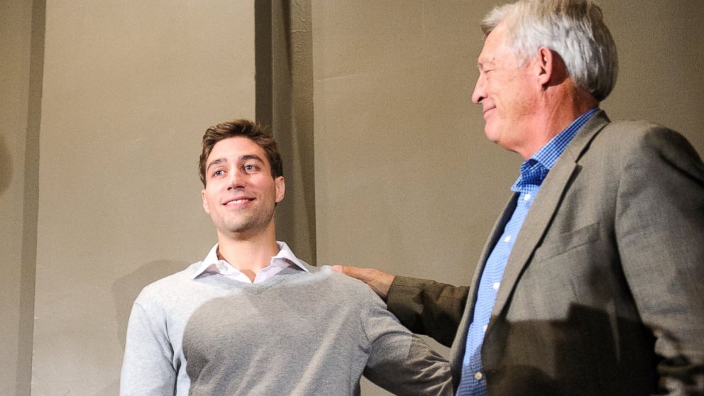 PHOTO: Ryan Ferguson, right, and his father Bill Ferguson share a moment during a press conference in Columbia, Mo., after Ryans release from prison.