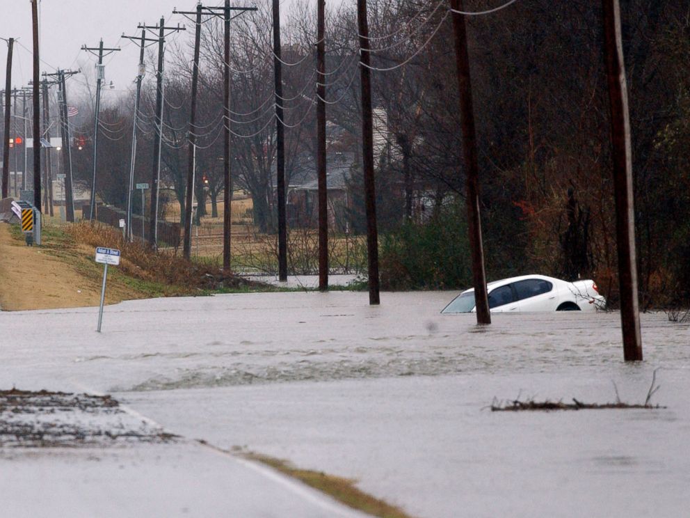 PHOTO:A car is seen submerged in water as days of heavy rain caused widespread flooding in Miami, Okla., Dec. 27, 2015.