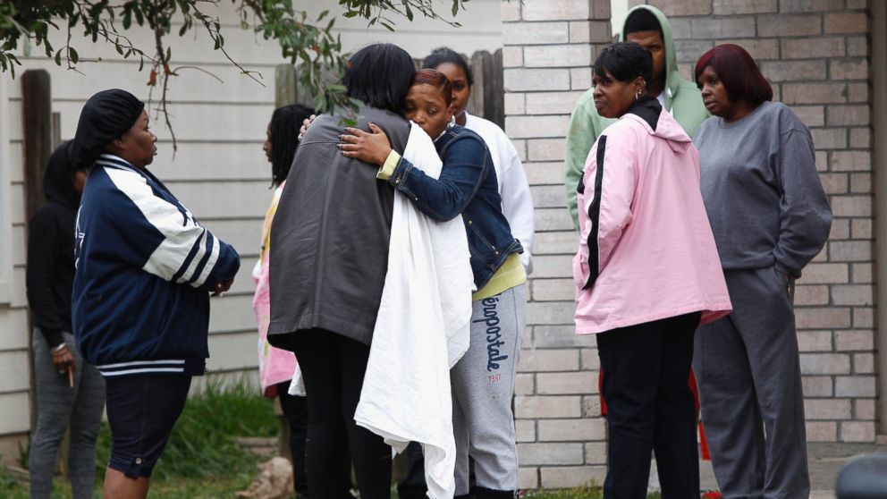 PHOTO: Family and friends console each other outside 7318 Enchanted Creek in Cypress, Texas, Sunday, Nov. 10, 2013.