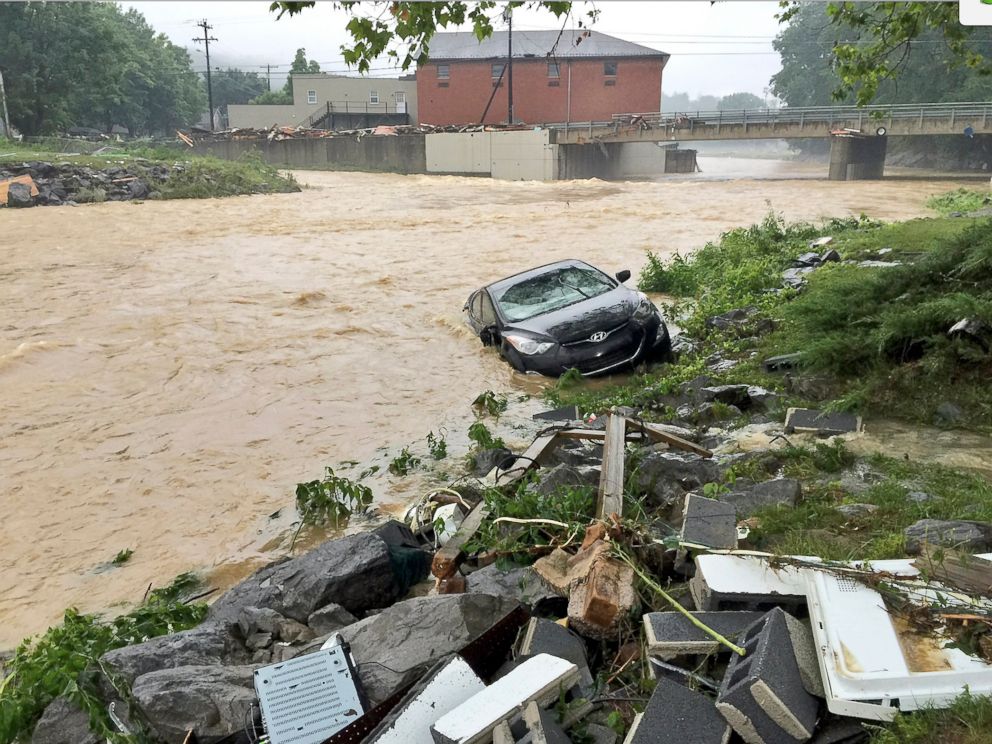 PHOTO: In this photo released by the The Weather Channel, a vehicle rests on the in a stream after a heavy rain near White Sulphur Springs, W.Va., June 24, 2016.