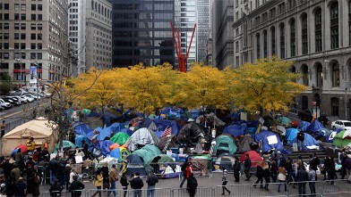 PHOTO: Occupy Wall Street tents are set-up under fall-colored trees in Zuccotti Park in New York, Nov. 13, 2011.