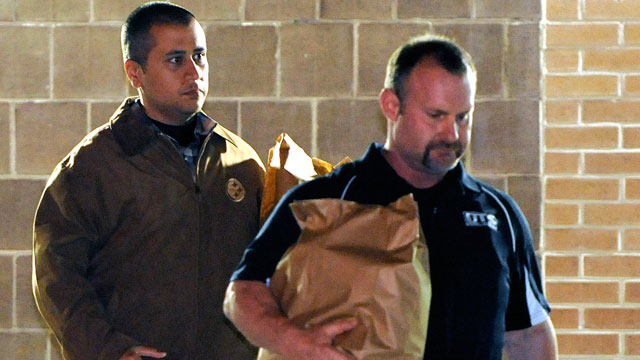 PHOTO: George Zimmerman, left, walks out of the intake building at the John E. Polk Correctional Facility with an unidentified man on Sunday, April 22, 2012, in Sanford, Fla.