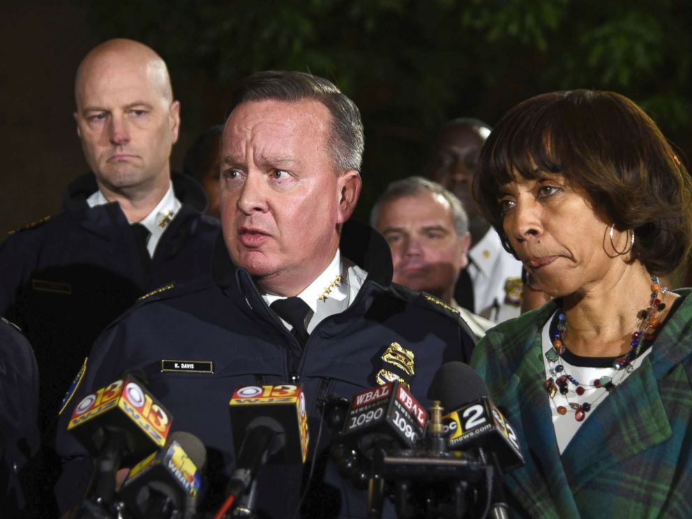 PHOTO: Police commissioner Kevin Davis, center, talks to the press after a police officer was shot, as States Attorney for Baltimore Marilyn Mosby, left, and Baltimore Mayor Catherine Pugh, right, stand nearby, Nov. 15, 2017, in Baltimore, Md.