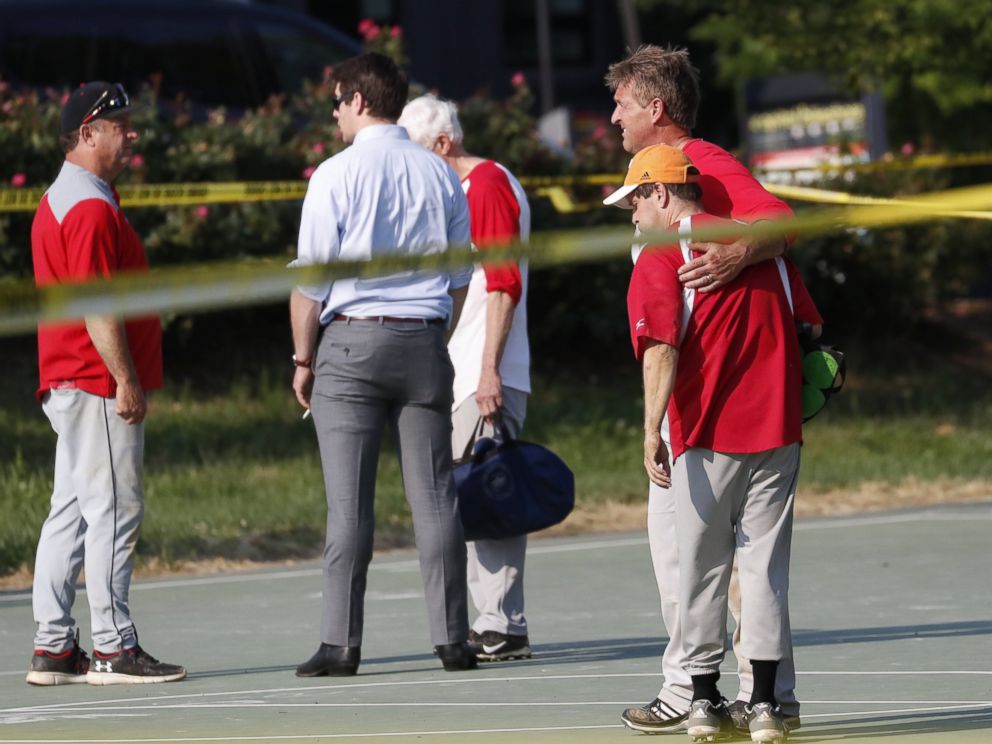 PHOTO: Republican Senator from Arizona Jeff Flake hugs another member of the Republican congressional baseball team following a shooting in Alexandria, Va., June 14, 2017.