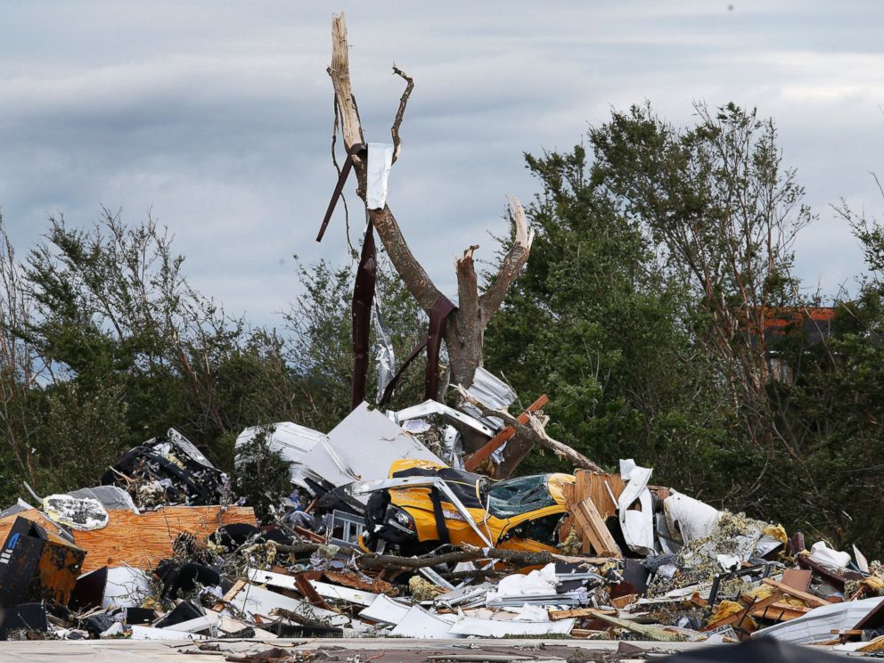 PHOTO: Cars and damaged material is seen piled up at a local car dealership that was destroyed when a large tornado hit the area near Canton, Texas, April 30, 2017.