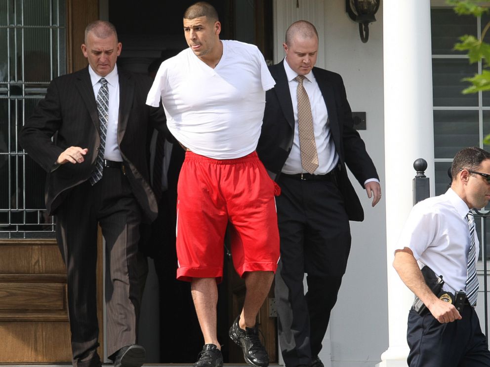 PHOTO: New England Patriots tight end Aaron Hernandez was arrested and led out of his home in handcuffs, on June 26, 2013, North Attleborough, Mass. 