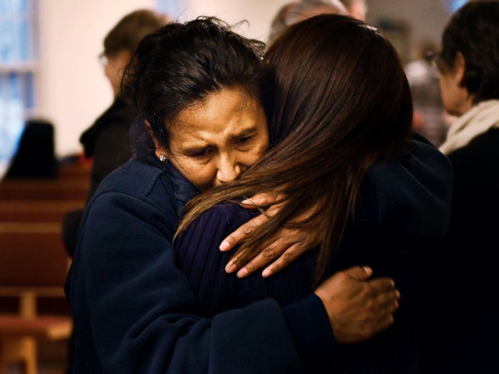 PHOTO: Jeanette Vizguerra hugs her friend Ingrid Encalada Latorre after Latorre announces her claim of Sanctuary at a Mountain View Friends Meeting.