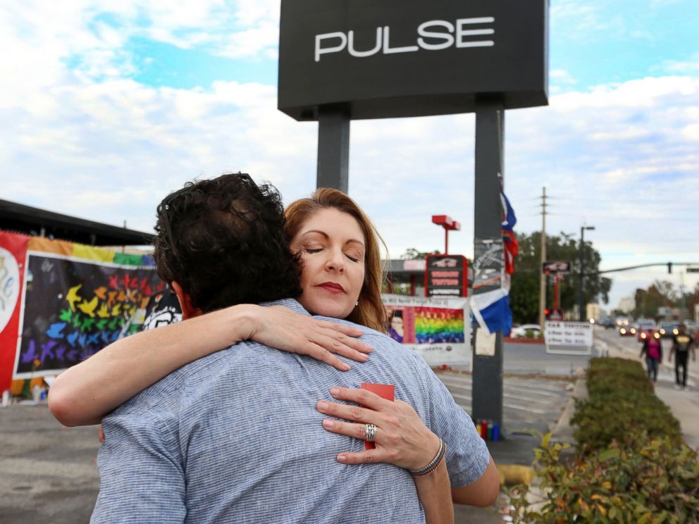 PHOTO: Barbara Poma, right, the owner of the Pulse Nightclub, is hugged, Dec. 5, 2016, in front of the club after a press conference.