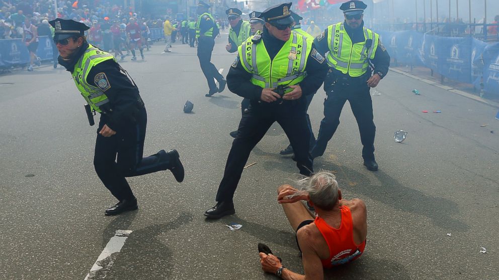 PHOTO: Boston police officers respond to a bombing at the finish line of the 2013 Boston Marathon, April 15, 2013, in Boston.