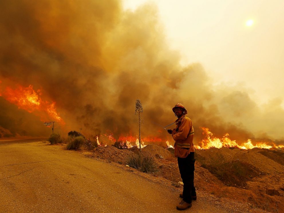 PHOTO: A firefighter keeps watch on the path of the Sand fire as it burns out of control along Soledad Canyon Road near Acton on July 24, 2016. 