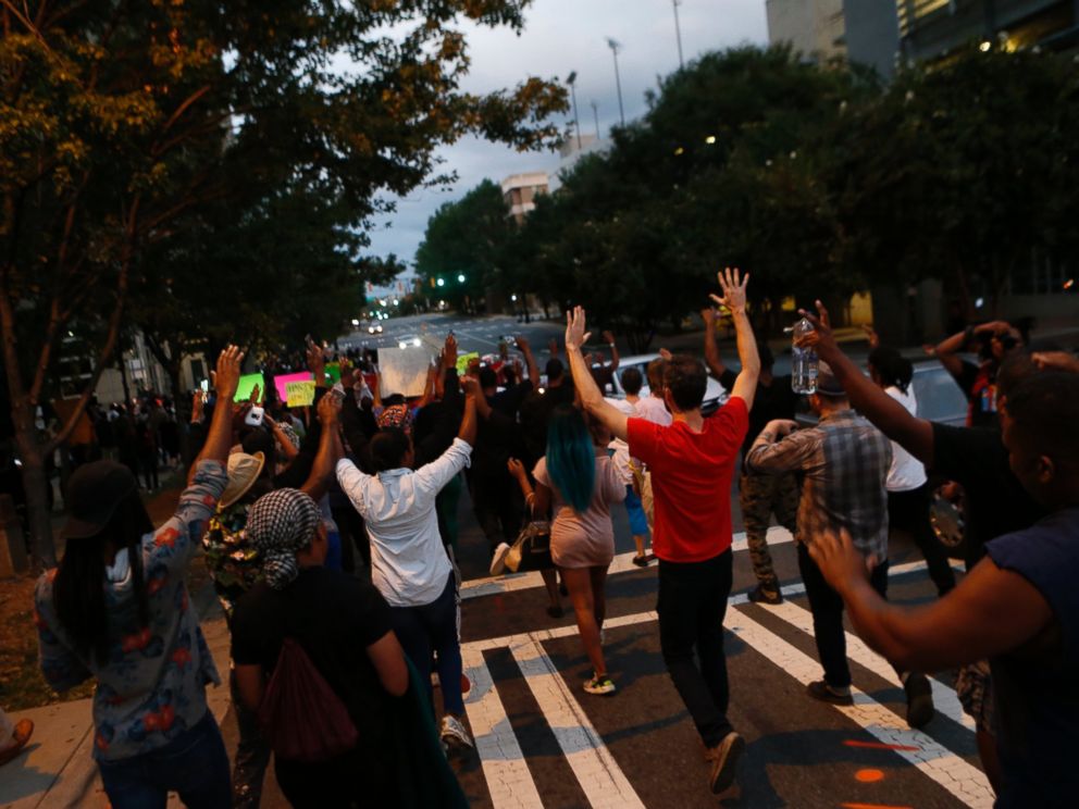 PHOTO: Residents gather for a vigil and march to protest the death of Keith Scott Sept. 21, 2016 in Charlotte, North Carolina. 