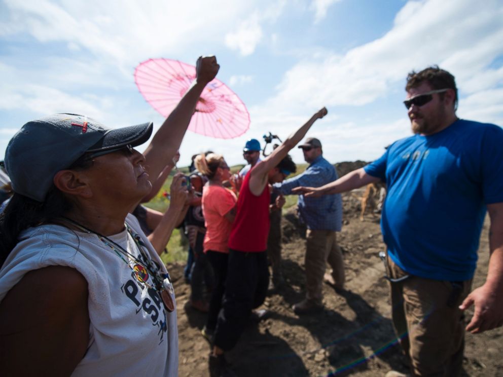 PHOTO: Security agents, right, confront protestors on the worksite for the Dakota Access Pipeline (DAPL) oil pipeline, near Cannonball, North Dakota, Sept. 3, 2016.