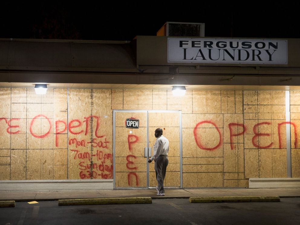 PHOTO: Plywood covers the glass front of a strip mall along West Florissant Street on Nov. 12, 2014 in Ferguson, Mo.