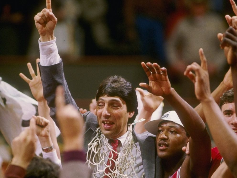 PHOTO: Head coach Jim Valvano of the North Carolina State Wolfpack celebrates with his team after the Wolfpack defeated the Houston Cougars 54-52 in the NCAA men’s basketball championship game at University Arena in Albuquerque, New Mexico.