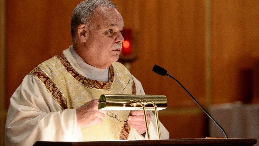 PHOTO: In this Dec. 14, 2012 photo, Monsignor Robert Weiss, of St. Rose of Lima Roman Catholic Church, celebrates mass at a vigil for victims of the Sandy Hook Elementary School shooting in Newtown, Conn.