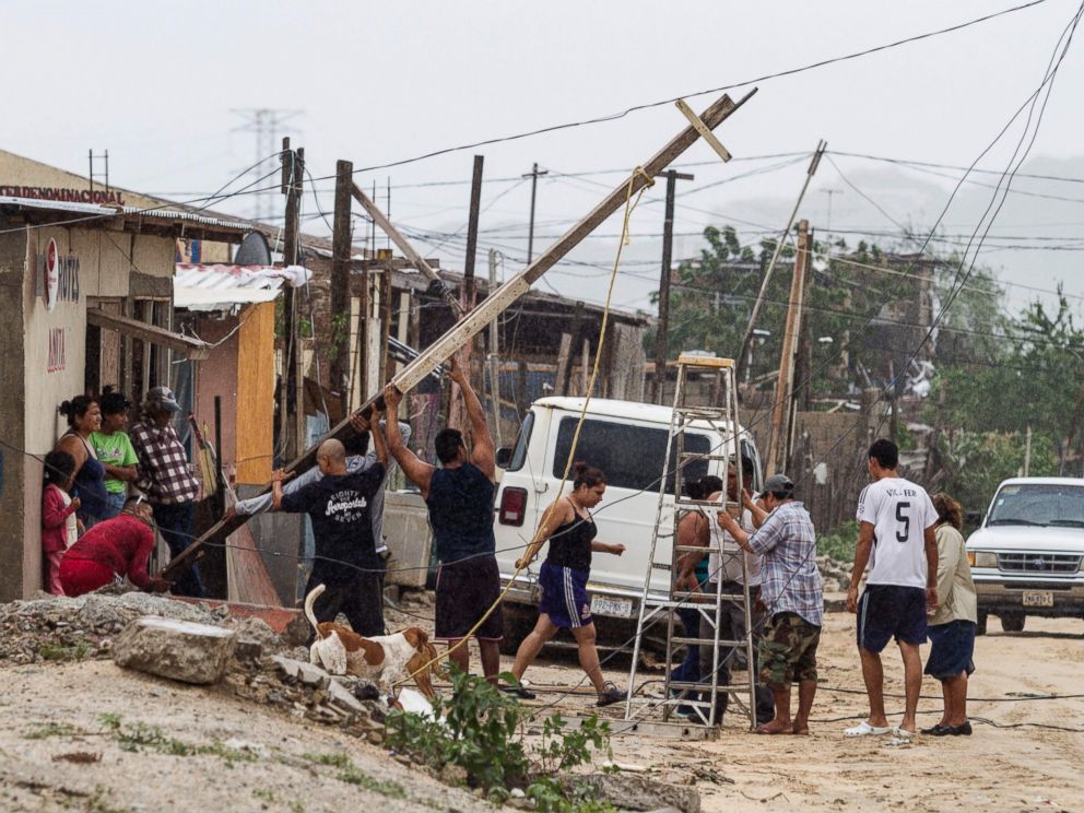 PHOTO: Local residents work in the area affected by Hurricane Newton in Los Cabos, Baja California Sur state, Mexico, Sept. 6, 2016. 