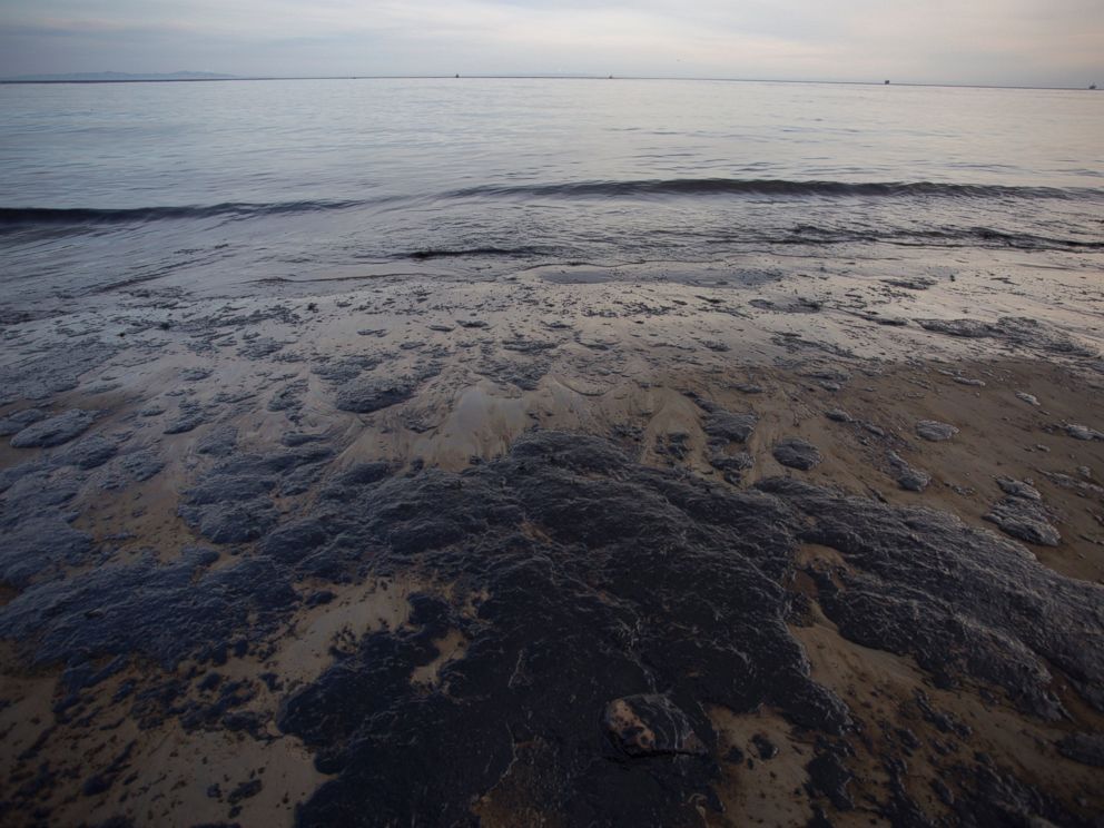 PHOTO: Spilled oil covers the beach at Refugio State Beach as the Channel Islands are seen in the distance on May 19, 2015 north of Goleta, Calif.
