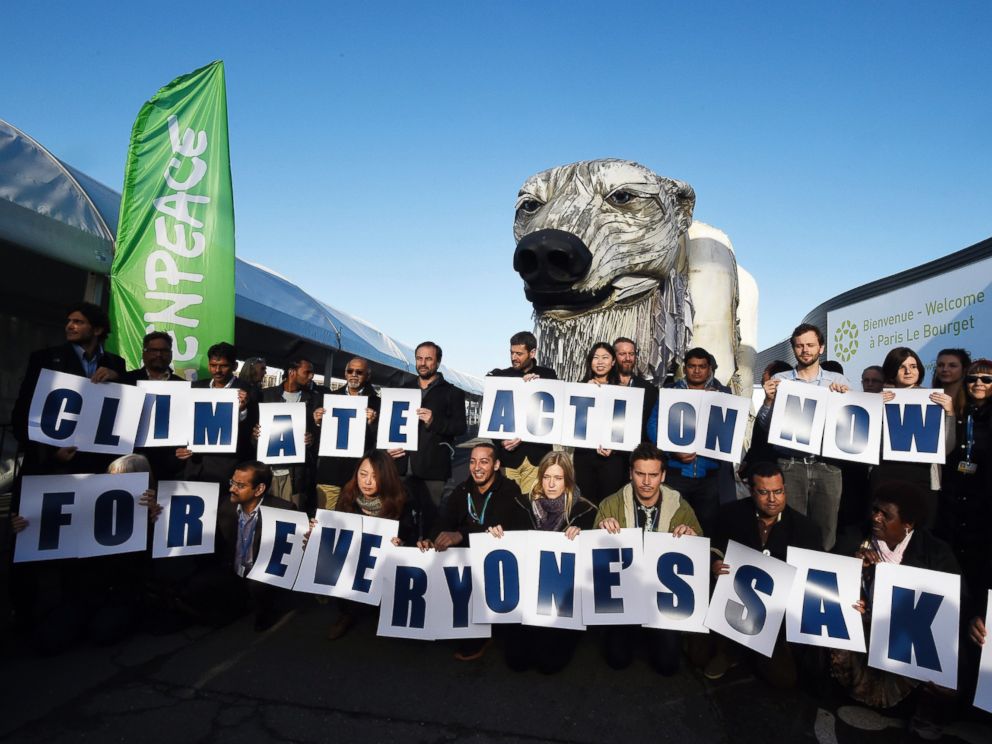 PHOTO: Greenpeace activists hold signs reading Action Now for everyones sake in front of Greenpeaces giant puppet polar bear Aurora during a protest at the COP21 United Nations climate change conference in Le Bourget, outside Paris, Dec. 9, 2015.
