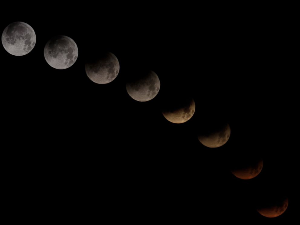 PHOTO: A combination of 10 pictures shows the moon in different stages of a total lunar eclipse seen from the Spanish Canary Island of Tenerife, April 15, 2014.