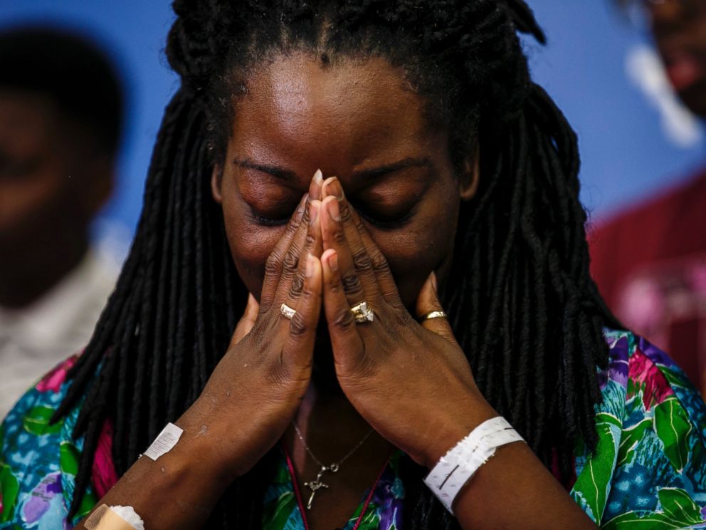 PHOTO: Shetamia Taylor gets emotional as her sons tell reporters of their account of the deadly night when a gunman attacked and killed 5 police officers and wounding 7 others, including Taylor, during a press conference in Dallas, Texas, July 10, 2016. 