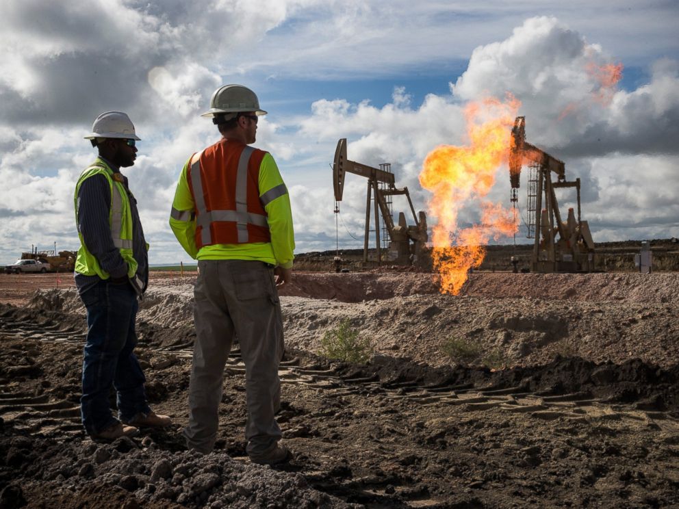 PHOTO: Gas flares is seen at an oil well site on July 26, 2013 outside Williston, North Dakota.