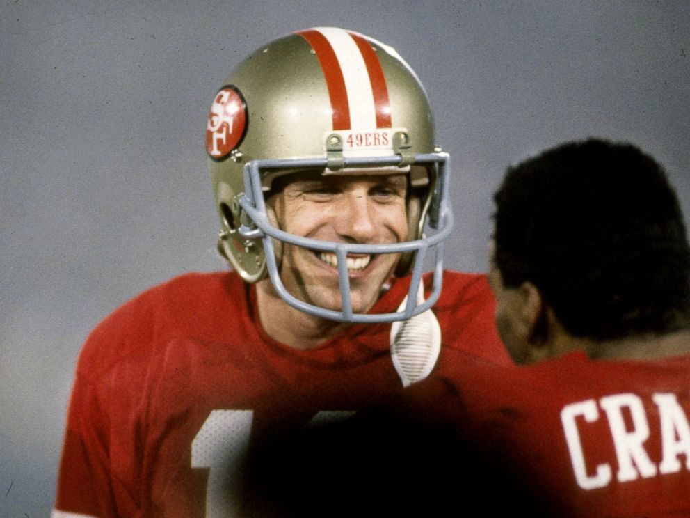 PHOTO: San Francisco 49ers Hall of Fame quarterback Joe Montana is all smiles as he talks to running back Roger Craig during Super Bowl XIX, Jan. 20, 1985, at Stanford Stadium in Stanford, Calif.