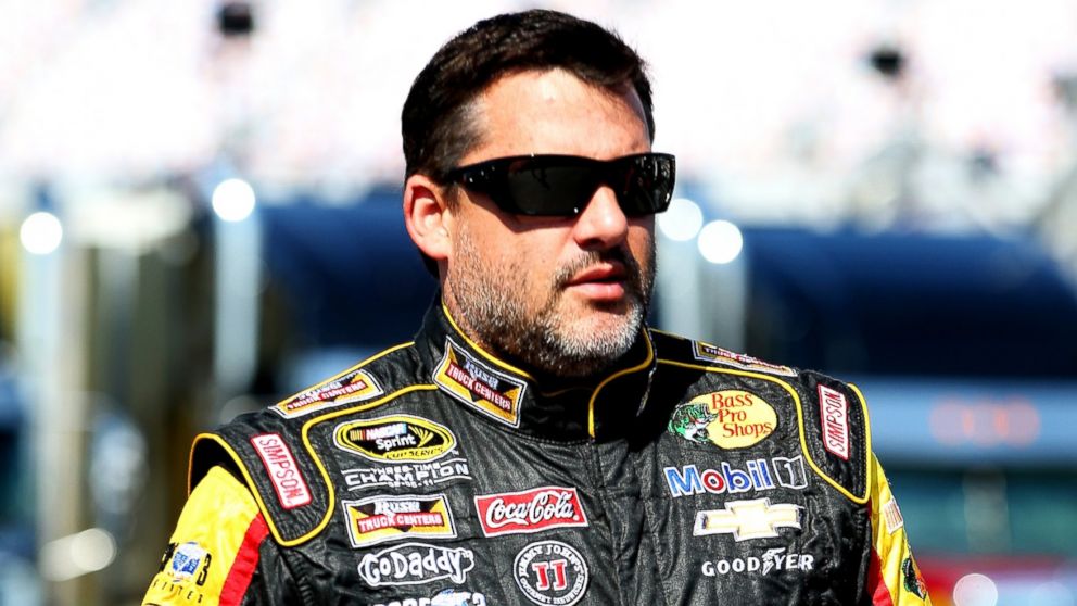 PHOTO: Tony Stewart walks in the garage area during practice for the NASCAR Sprint Cup Series Quaker State 400 on June 27, 2014 in Sparta, Ky.