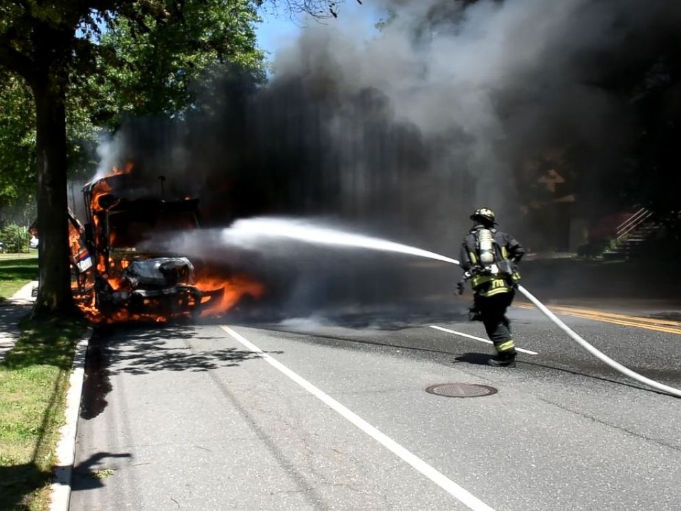 PHOTO: A firefighter seen here extinguishing a bus fire on Long Island, New York, June 10, 2016.