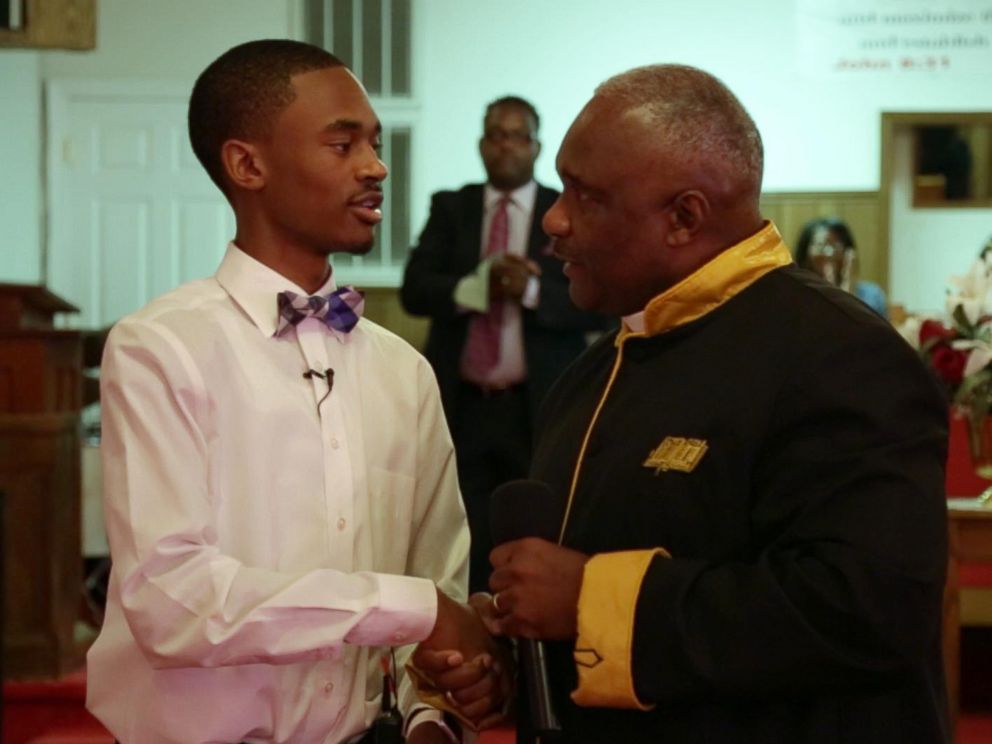 PHOTO: Chris Suggs receives an award of recognition from Sand Hill FWB Church.