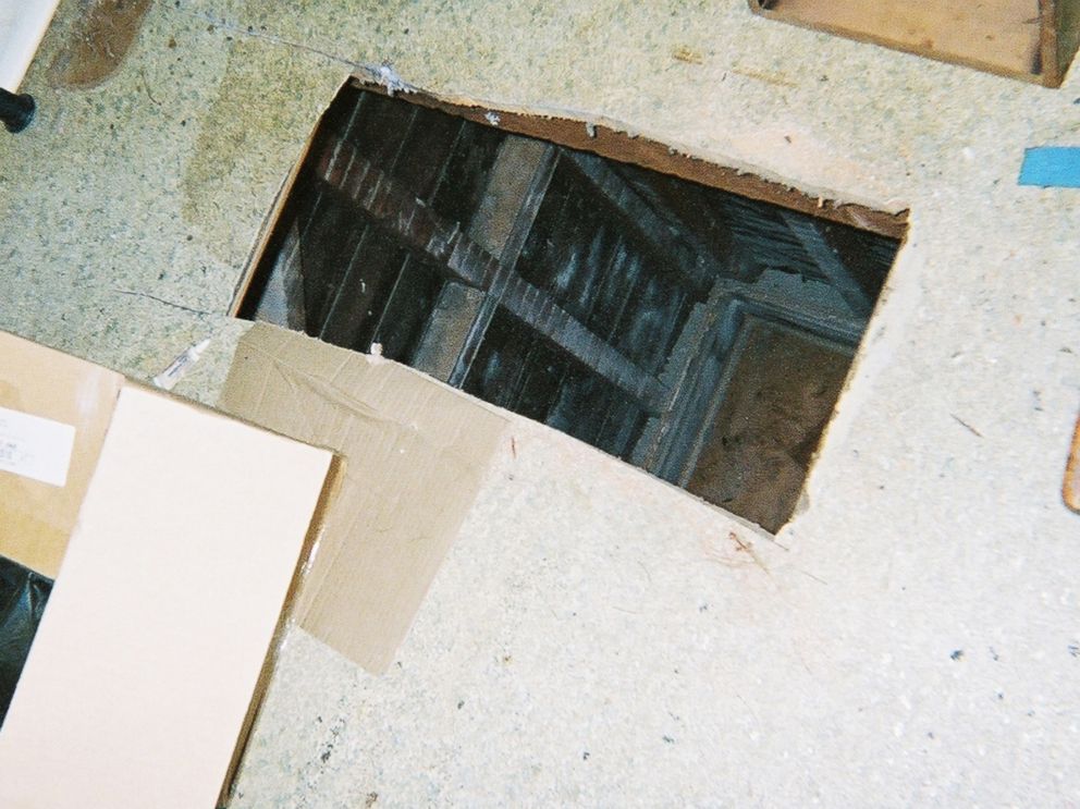 PHOTO: Kip and Nicole Macy cut this hole through the floor of their tenants apartment with a saw.