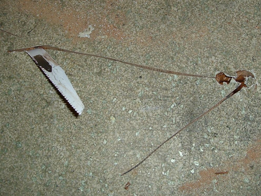 PHOTO: Photo of a saw stuck in the floor of a tenants apartment owned by Kip and Nicole Macy.